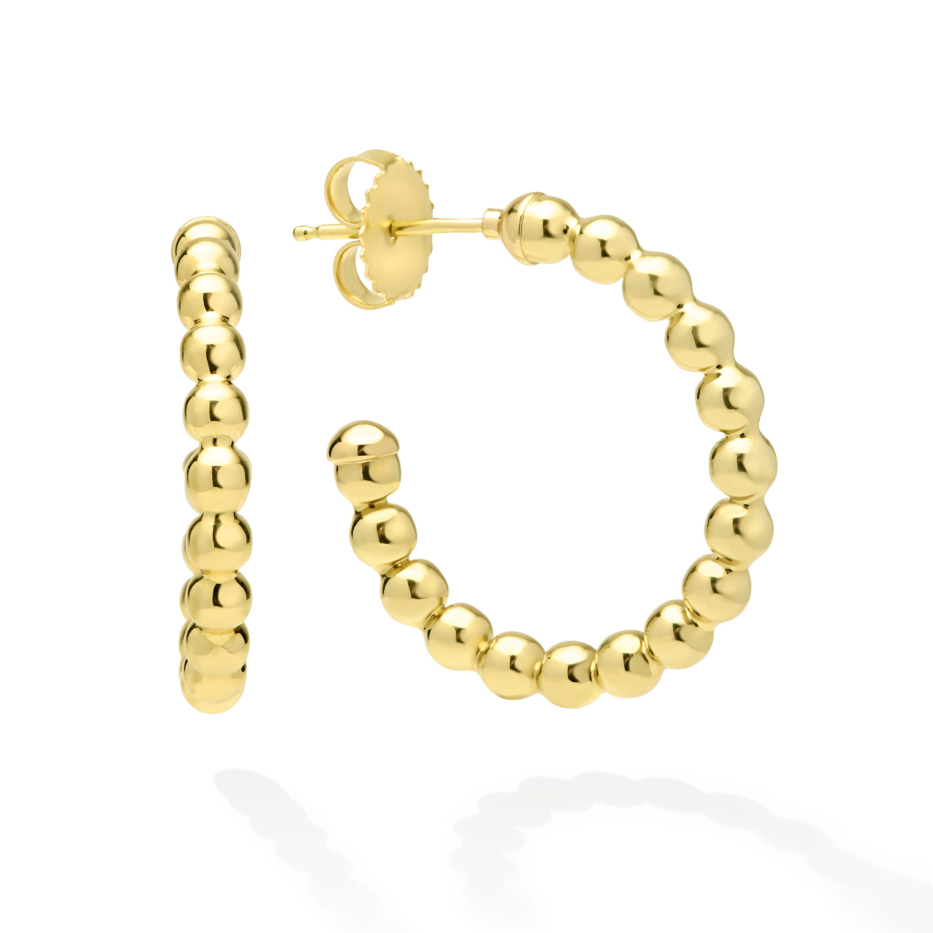 Gold hoop earrings with beaded design on a white background