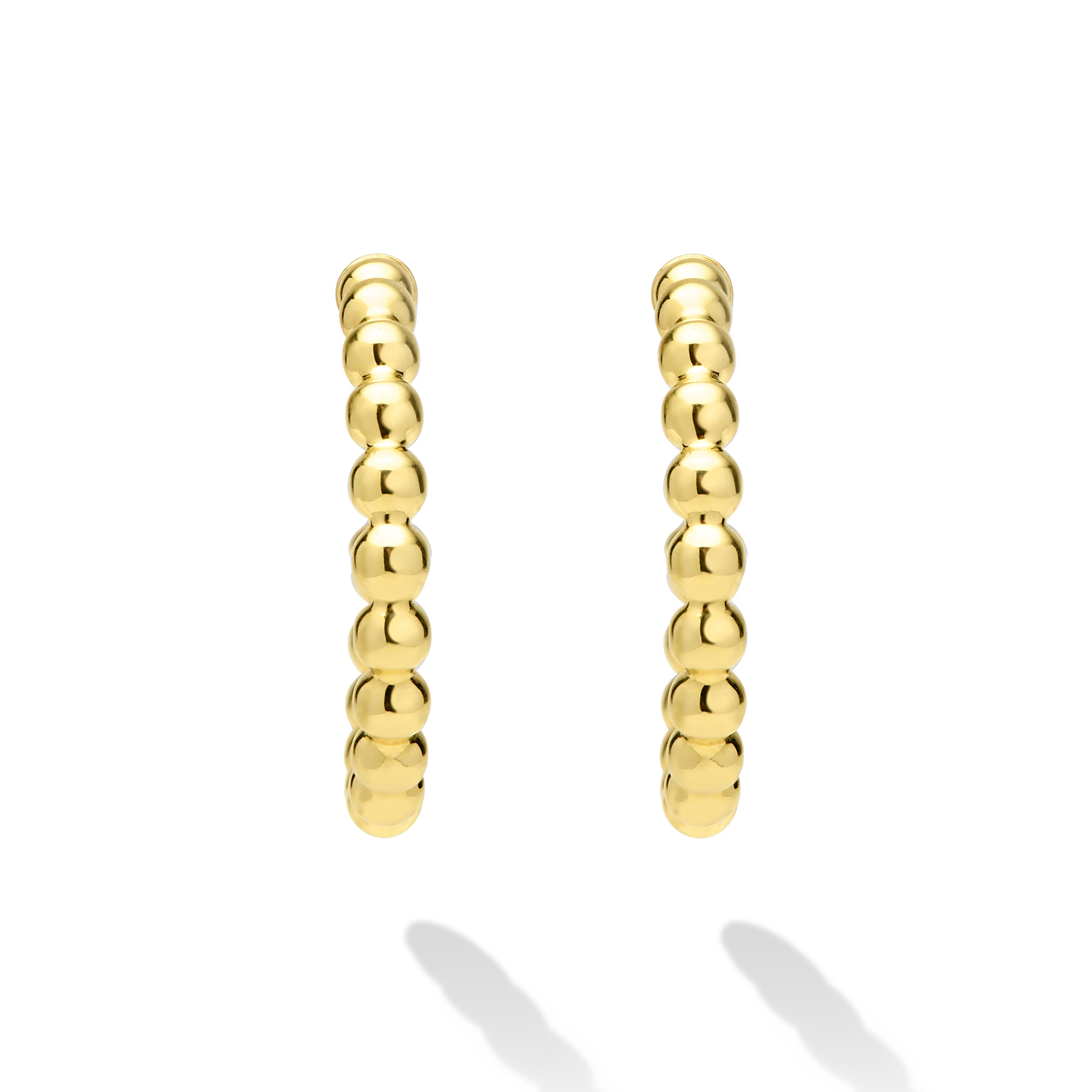 Gold hoop earrings on a white background
