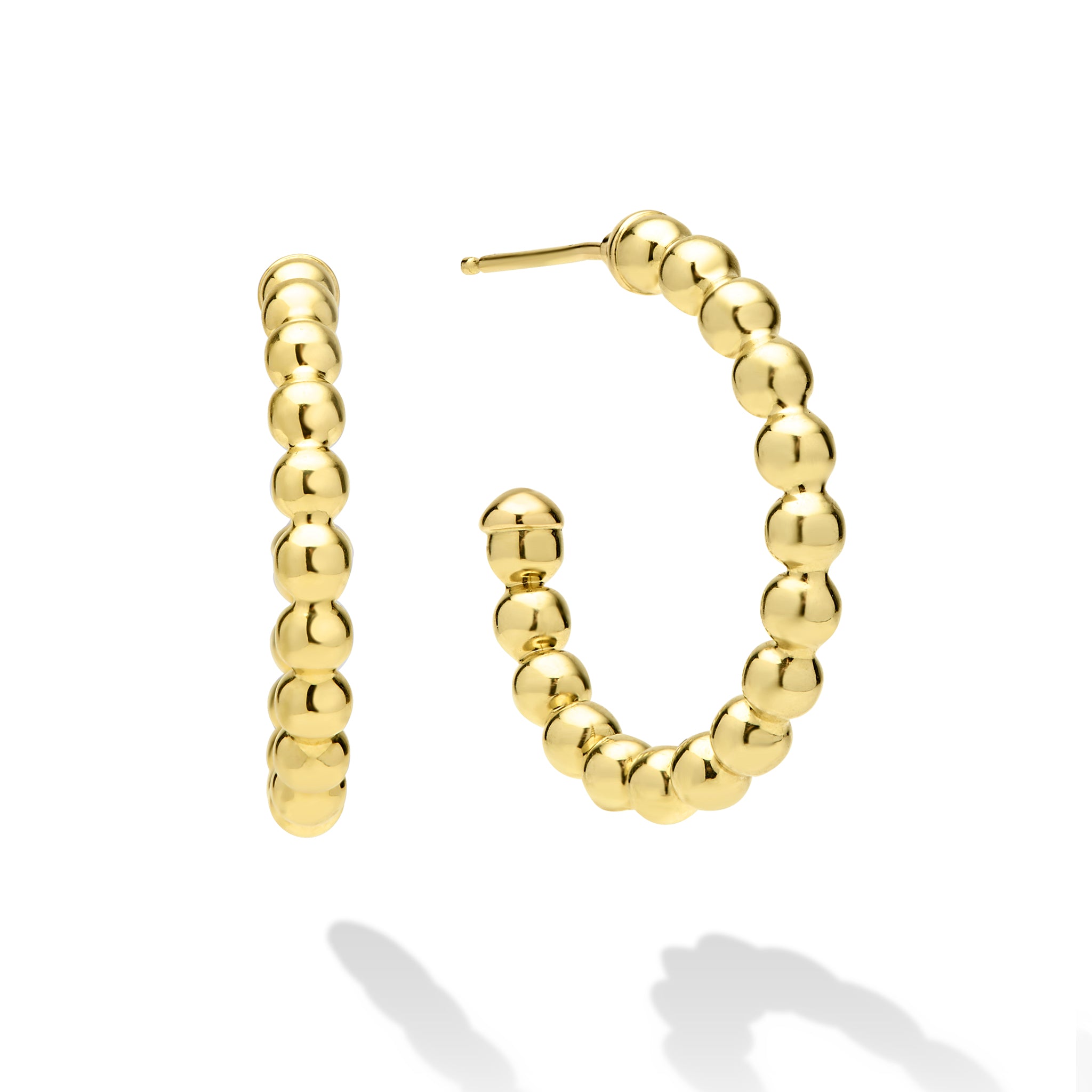 Gold hoop earrings on a white background