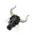 Intricately crafted black agate gemstone and 18K gold bull motif ring surrounded by sterling silver.