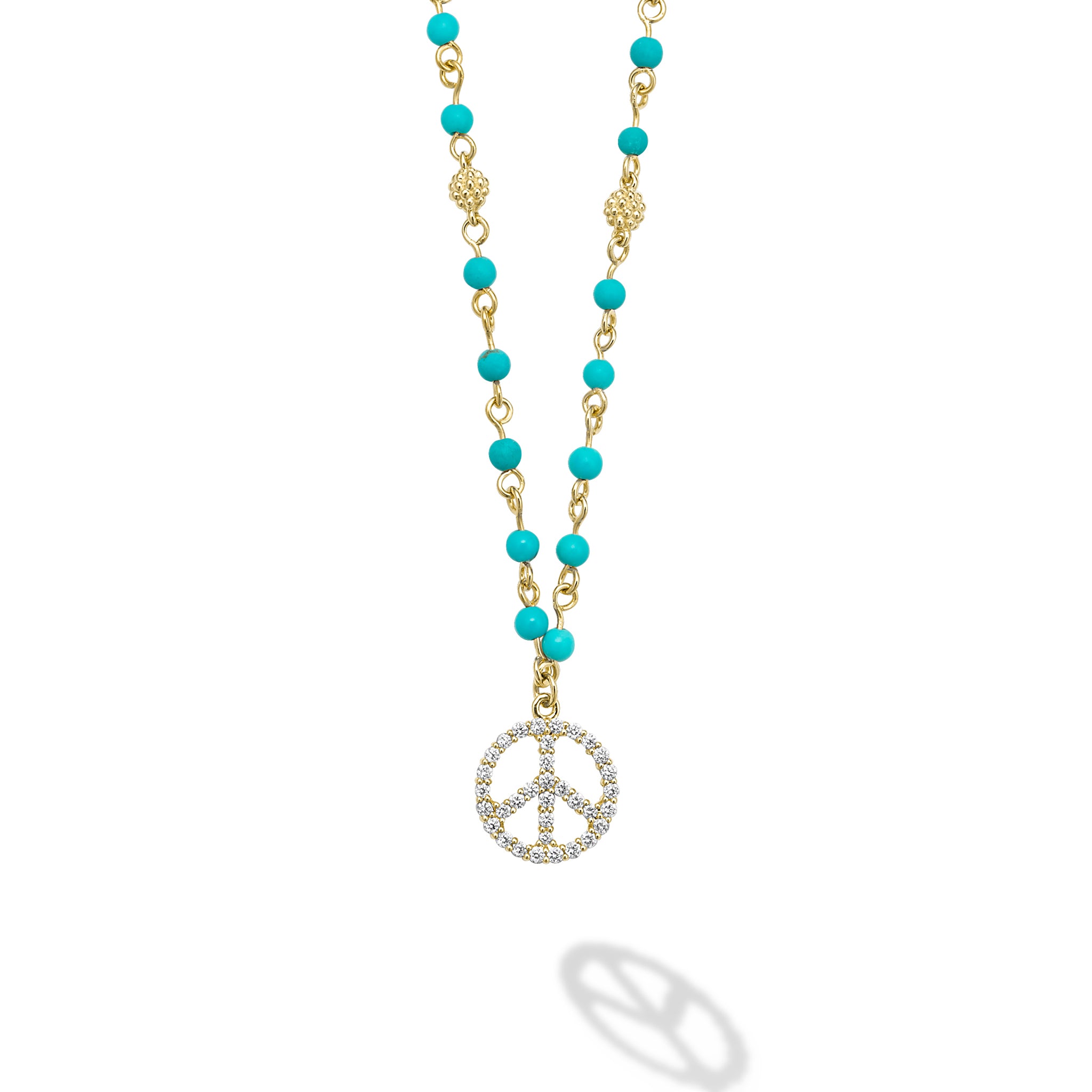 18k gold and black turquoise gemstones accented with round diamonds in a peace sign motif form this pendant necklace. LAGOS diamonds are the highest quality natural stones.