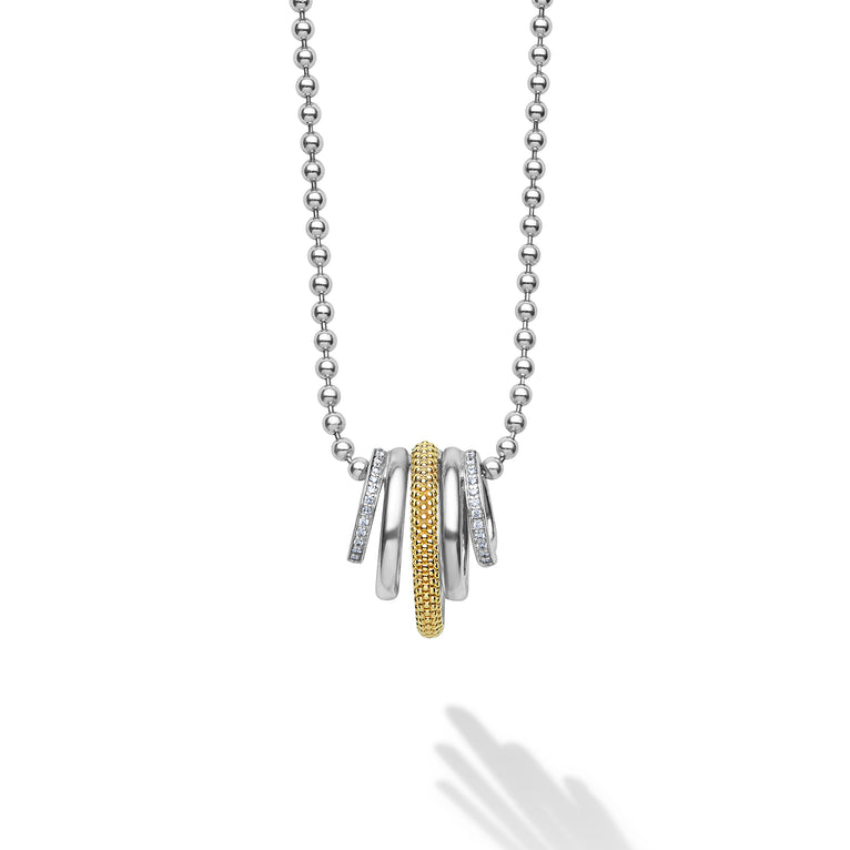 Smooth sterling silver, 18K gold superfine Caviar beading, and diamonds form five rings on a sterling silver chain. LAGOS diamonds are the highest quality natural stones.