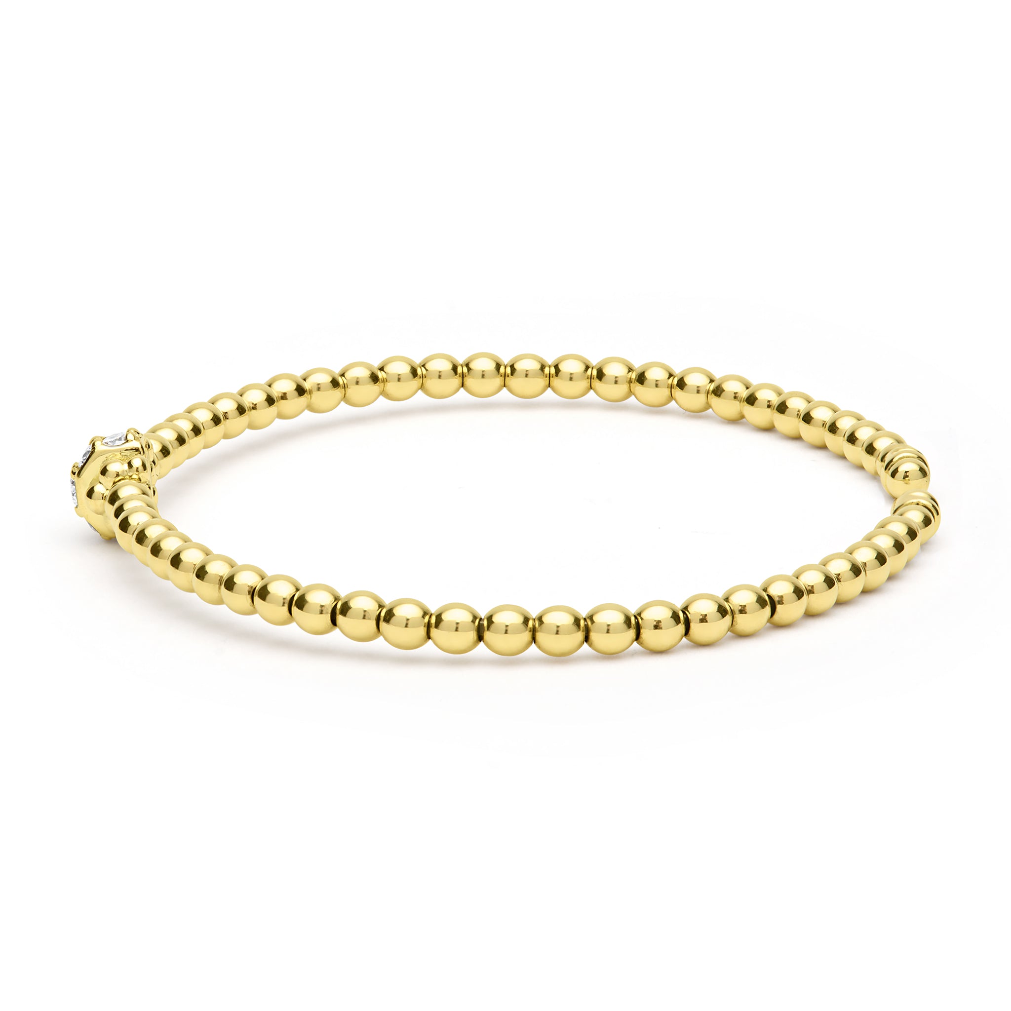 Gold beaded bracelet on a white background