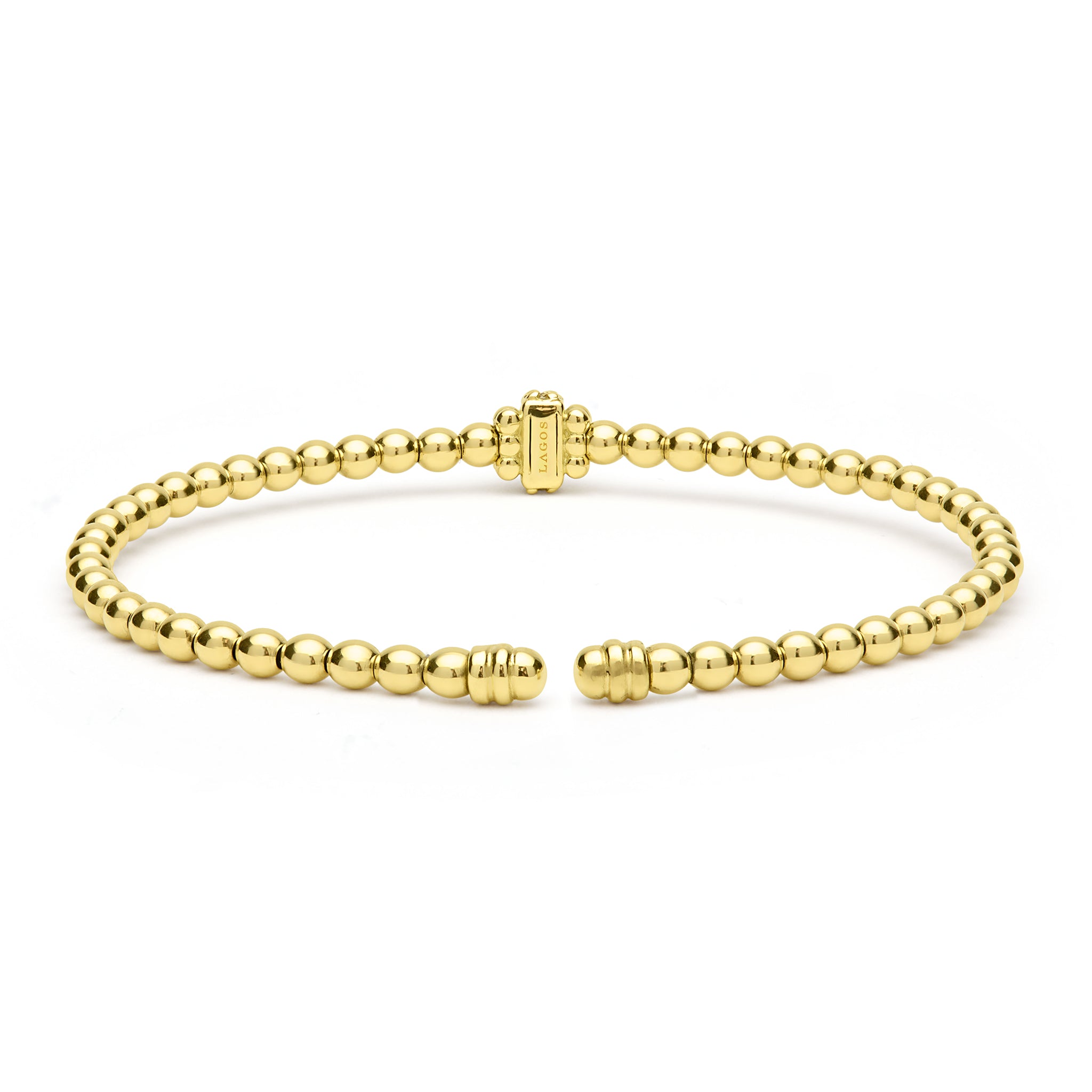 Gold beaded bracelet on a white background