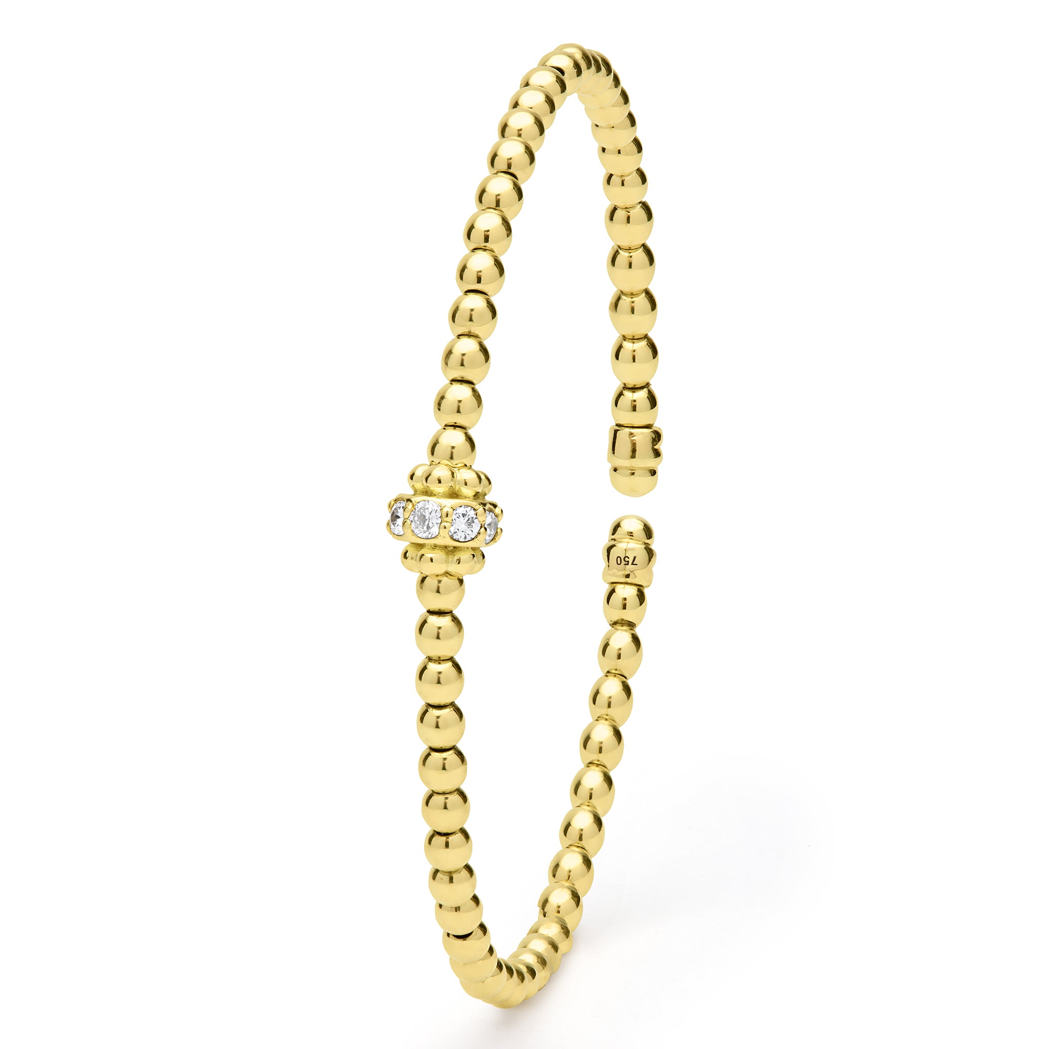 Gold beaded ring with a small diamond on a white background
