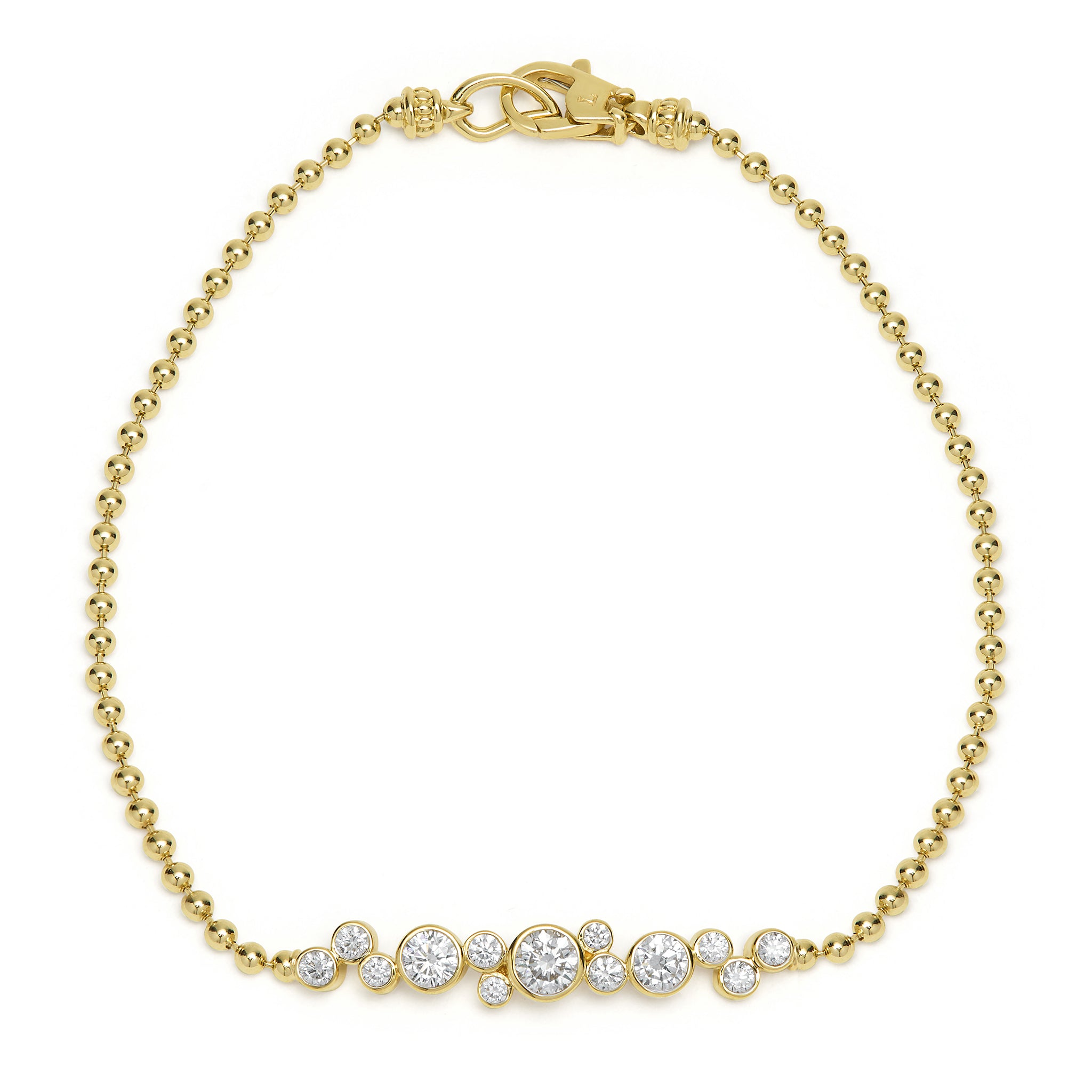 A delicate gold beaded bracelet, sparkling with a graduated row of bezel-set diamonds, finished with a secure lobster clasp for timeless elegance.