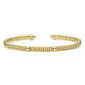 Signature Caviar 18K Gold Diamond Mini Versa Torque Bracelet with caviar beading, featuring an open cuff design and diamond accents.