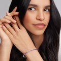 Woman model wearing amethyst bangle bracelet