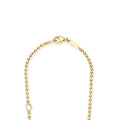 Gold beaded necklace with a lobster clasp on a white background