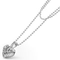 Silver heart-shaped pendant on a chain against a white background