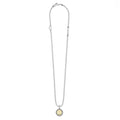 Signature Caviar H Initial Charm Necklace with a sterling silver bead chain and 18K gold h pendant encased in caviar beading, showcasing LAGOS elegance.