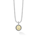 Signature Caviar O Initial Charm Necklace featuring a sterling silver ball chain with an 18K gold 'O' charm, framed by caviar beading, crafted by LAGOS.