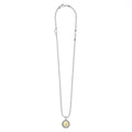 Signature Caviar U Initial Charm Necklace features sterling silver bead chain with a lobster clasp and a round pendant, showcasing an 18K gold “U” initial framed by caviar beading.