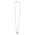 Signature Caviar X Initial Charm Necklace in sterling silver with 18K gold 'X' pendant, caviar beading, heart link, and LAGOS tag.