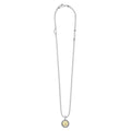 Signature Caviar Z Initial Charm Necklace features a sterling silver beaded chain with an 18K gold initial pendant, accented by an open heart and “LAGOS” tag.