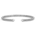 Silver bracelet with a textured design on a white background