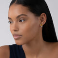 model wearing Citrine huggie earrings