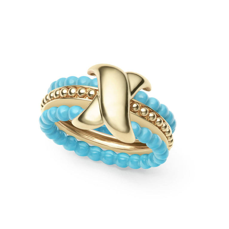 Three stacking rings form this set with two ceramic beaded bands and an 18K gold X-motif center band with Caviar beading. Five sets of ceramic bands are included - Black, White, Blue, Dark Blue, Pink - to mix and match.