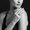 Woman's hand rests on shoulder, showcasing the Rittenhouse Bezel-Set Citrine Ring with 18K Caviar beading on a sterling silver band.