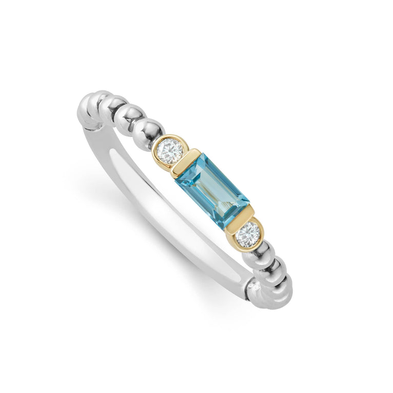 Swiss blue topaz gemstone with diamonds form this stacking ring surrounded by 18K gold and sterling silver Caviar beading. LAGOS diamonds are the highest quality natural stones.