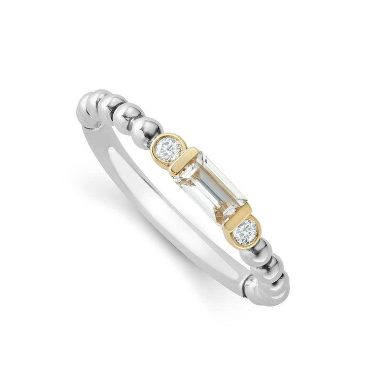 White topaz gemstone with diamonds form this stacking ring surrounded by 18K gold and sterling silver Caviar beading. LAGOS diamonds are the highest quality natural stones.