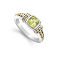 Peridot gemstone ring surrounded by sterling silver and 18K gold Caviar beading.