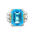 Glacier Large Emerald-Cut Swiss Blue Topaz Ring with a radiant gemstone in sterling silver prongs, accented with 18K gold caviar beading and chunky silver elements.