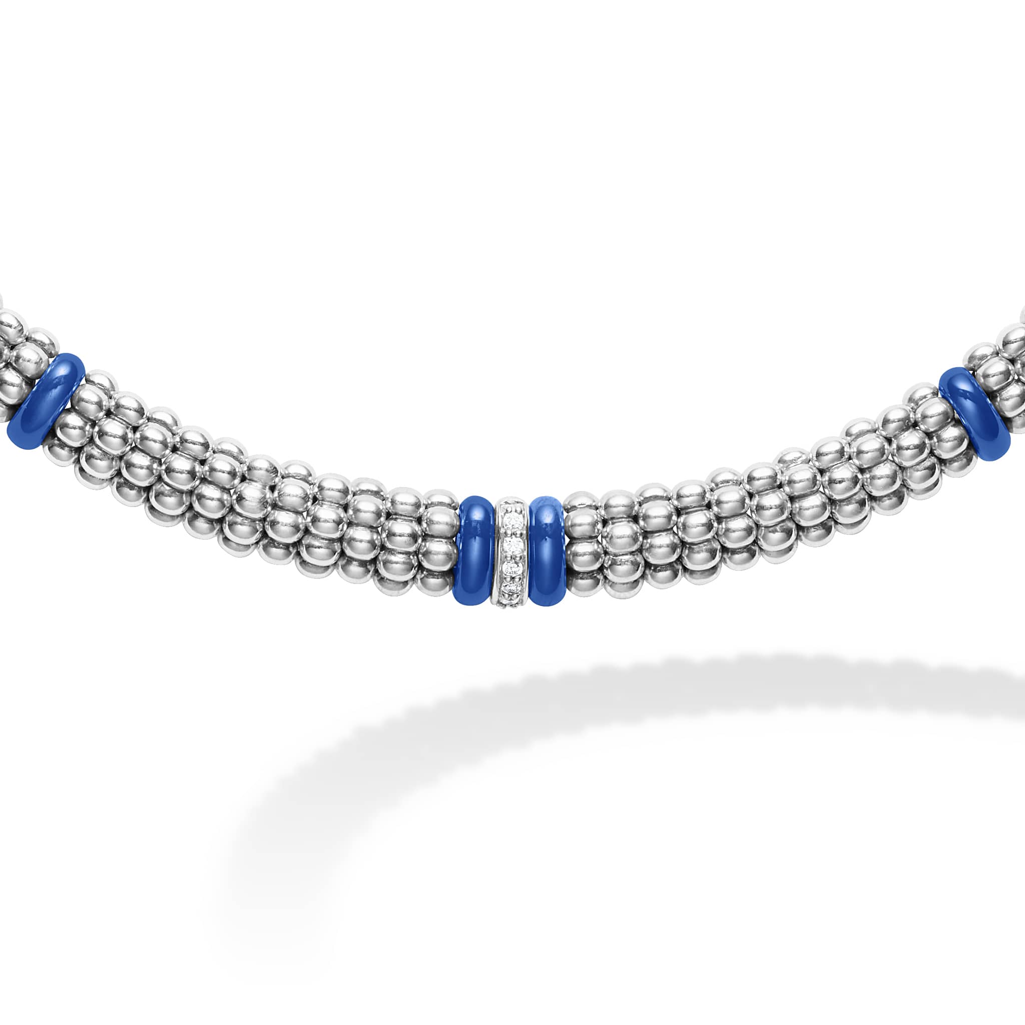 One diamond station set in sterling silver surrounded by ten ultramarine ceramic stations with sterling silver Caviar beading. LAGOS diamonds are the highest quality natural stones.