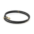 Black Caviar Ceramic Wrap Diamond Bracelet with glossy black beads, 18k gold pavé-set diamond endcaps, showcasing LAGOS craftsmanship and elegance.