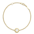 An 18k gold bracelet including a Mother of Pearl inlay station with Caviar beaded details.