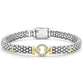 A single diamond circle set in 18K gold accents this sterling silver Caviar beaded bracelet. LAGOS diamonds are the highest quality natural stones.