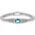 Swiss blue topaz bezel-set gemstone and sterling silver Caviar beading with 18K gold detailing forms this bracelet.