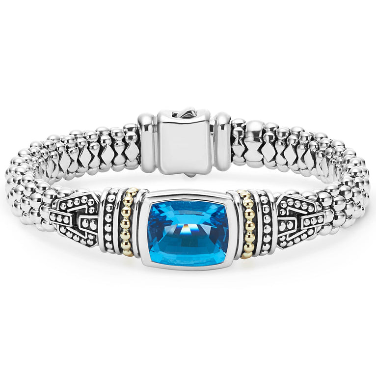 Swiss blue topaz bezel-set gemstone and sterling silver Caviar beading with 18K gold detailing forms this bracelet.