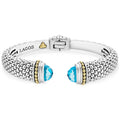 Expertly crafted Caviar beading with highly polished sterling silver stations comprise this innovative bracelet detailing swiss blue topaz gemstone end caps. Finished with a hinge clasp.