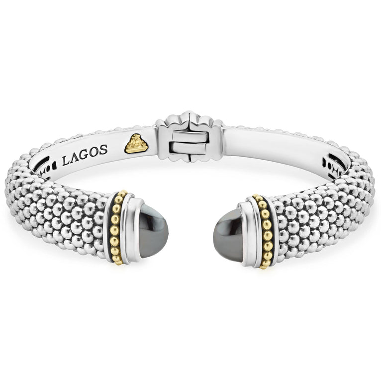 Expertly crafted Caviar beading with highly polished sterling silver stations comprise this innovative bracelet detailing hematite gemstone end caps. Finished with a hinge clasp.