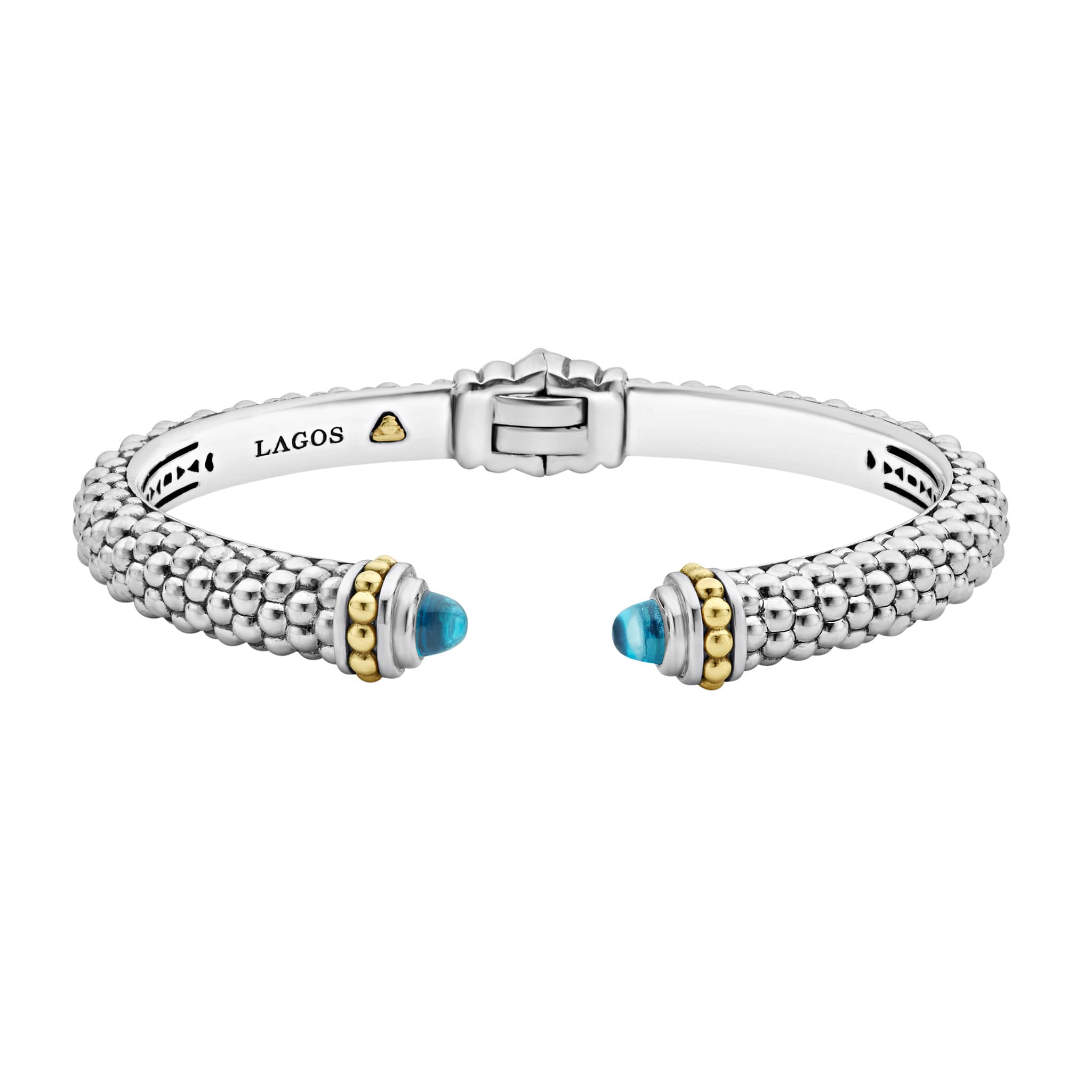 Caviar beading and highly polished sterling silver stations comprise this innovative cuff bracelet detailing swiss blue topaz gemstone end caps.