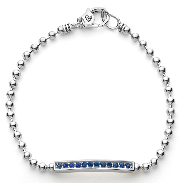 A linear blue sapphire gemstone station set by sterling silver Caviar beading forms this bracelet.