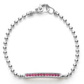 A linear ruby gemstone station set by sterling silver Caviar beading forms this bracelet.
