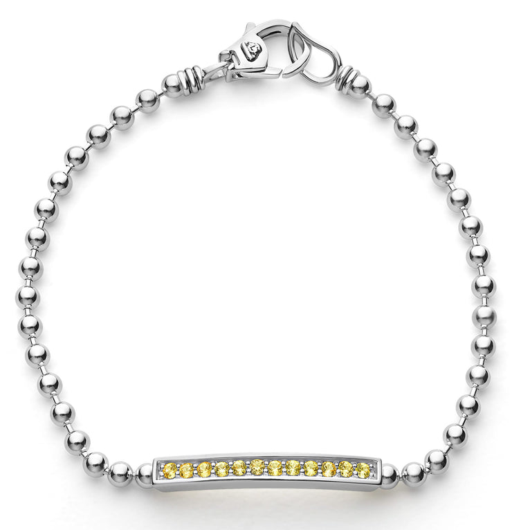 A linear yellow sapphire gemstone station set by sterling silver Caviar beading forms this bracelet.