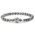 Eagle eye gemstone beaded bracelet with a sterling silver Caviar skull.