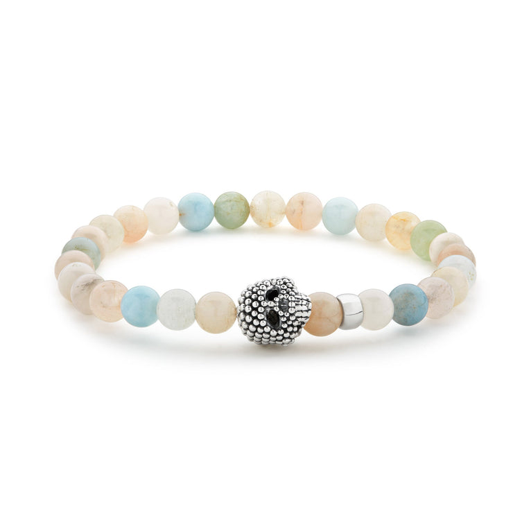 Morganite gemstone beaded bracelet with a sterling silver Caviar skull.