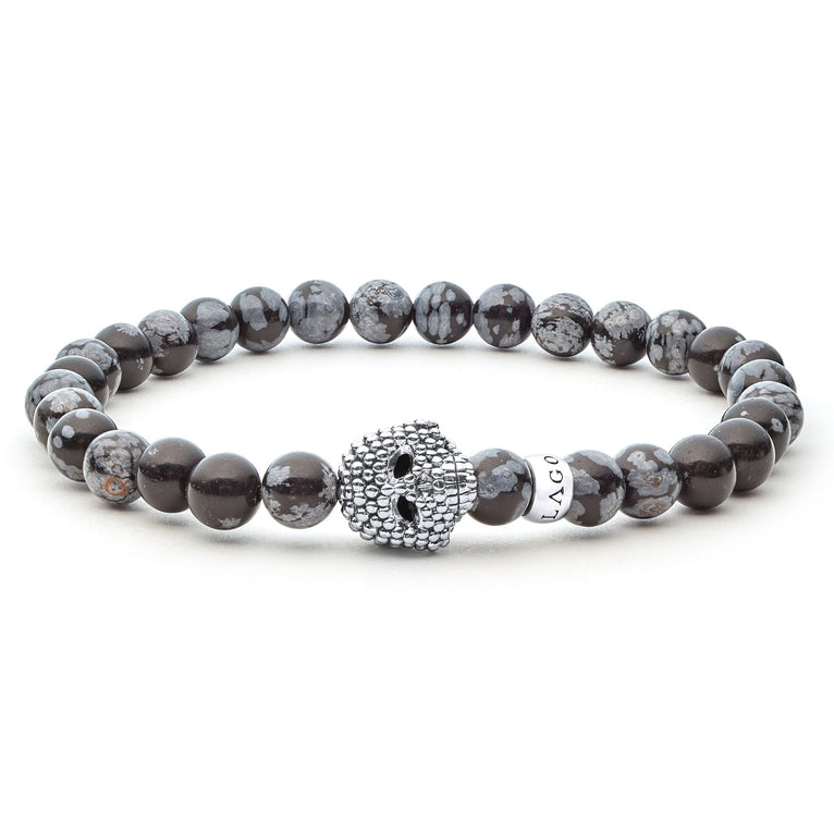 Snowflake obsidian gemstone beaded bracelet with a sterling silver Caviar skull.