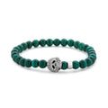 Malachite gemstone beaded bracelet with a sterling silver Caviar skull.