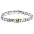 A peridot gemstone and sterling silver Caviar beading with 18K gold detailing forms this bracelet.