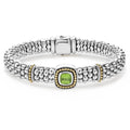 A peridot gemstone and sterling silver Caviar beading with 18K gold detailing forms this bracelet.