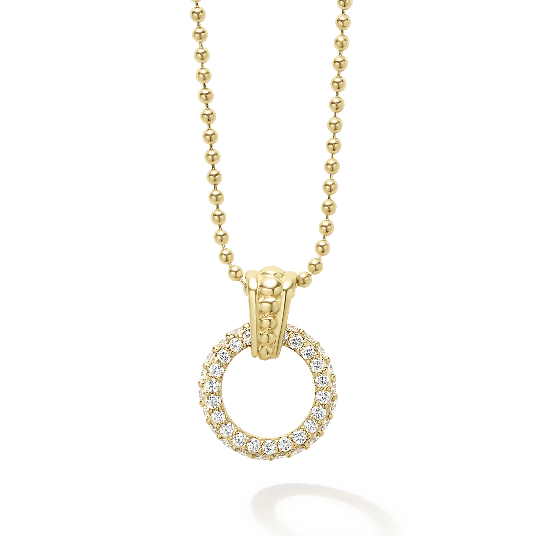 A diamond circle with an 18k gold Caviar beaded accent forms this pendant on a gold necklace. LAGOS diamonds are the highest quality natural stones.