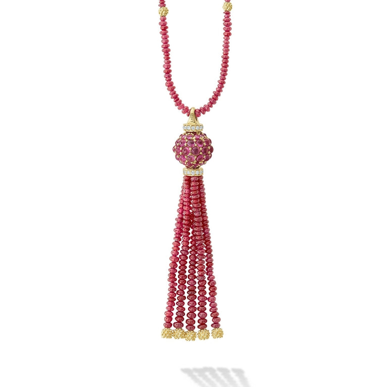 A LAGOS exclusive. A ruby gemstone necklace and ruby gemstone tassel pendant with 18K gold Caviar beading form this pendant necklace.