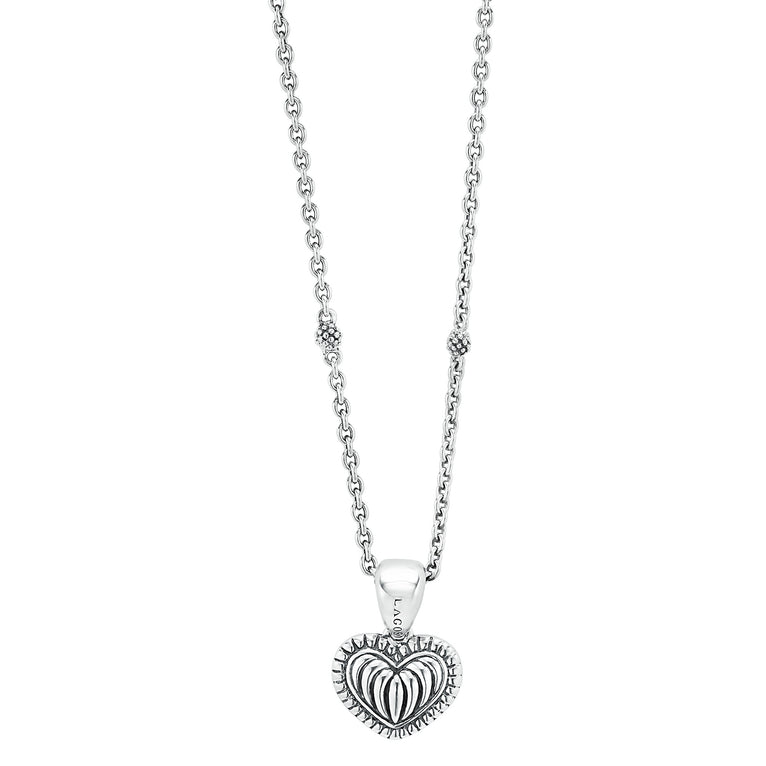 A LAGOS exclusive. Petite sterling silver heart pendant with fluting and Caviar beading finished on a versatile link necklace with six sterling silver Caviar beaded stations