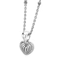 Beloved Fluted Heart Pendant Necklace featuring a ridged heart charm, Caviar beading, and a versatile sterling silver link chain with decorative bead elements.