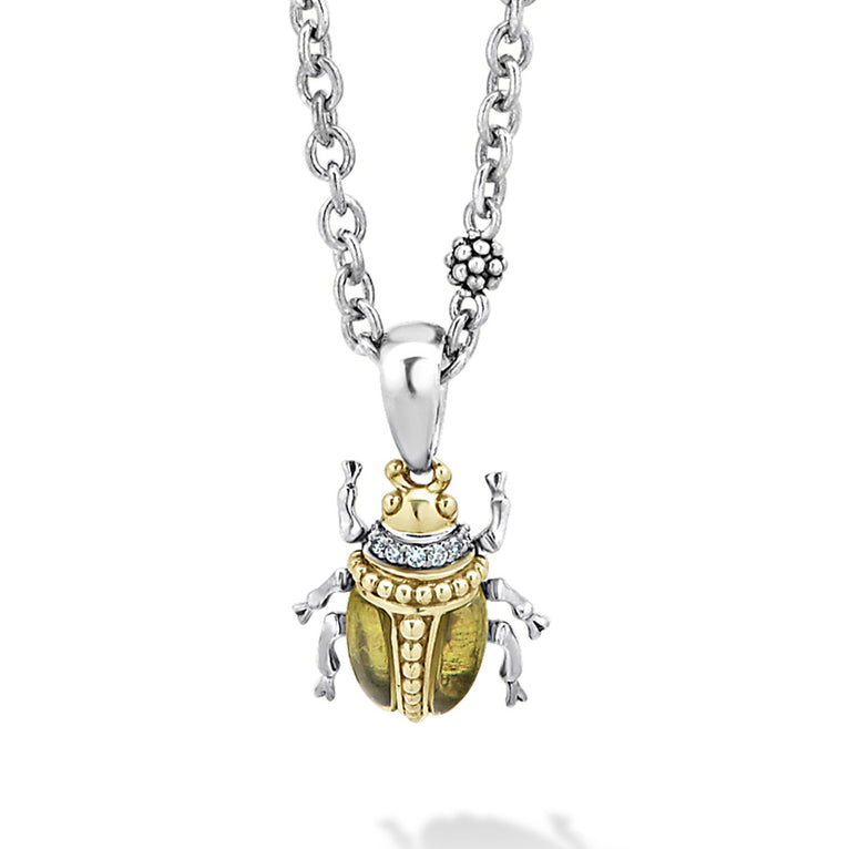 A LAGOS exclusive. Olive quartz with diamond, 18K gold and sterling silver accents forming a beetle pendant.